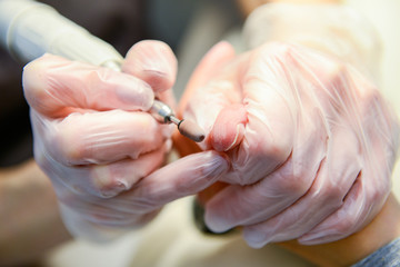 Photo of getting manicure procedure in process