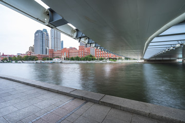Obraz premium empty floor and city skyline under blue sky, tianjin, china.