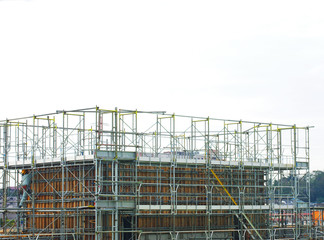 Building construction site with scaffolding