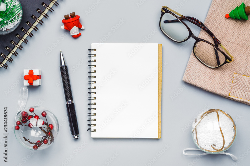 Poster mockup with white paper blank space notebook and christmas decorations on table. top view with copy 