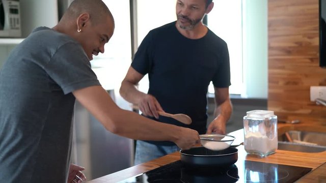 Gay Couple Making Tapioca - Brazilian Food at Kitchen