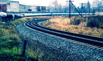railway in the industrial zone..empty rails with a semaphore, in anticipation of a freight train.