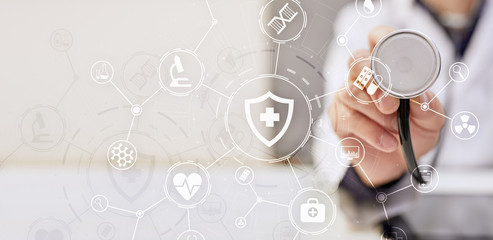 Medicine doctor with modern computer, virtual screen interface and icon medical network connection. Medical technology network and health care concept.