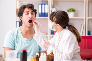 Young handsome man visiting female doctor dentist for removal of