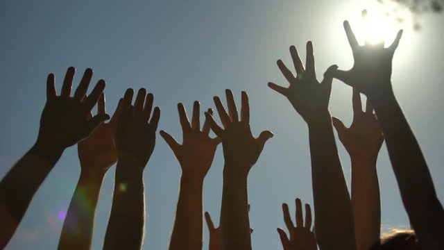 People raising and shaking hands, voting for democracy, volunteering campaign