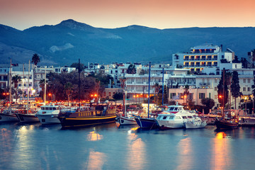 The capital of the island of Kos, Greece, view of the city and marina at sunset, a popular...