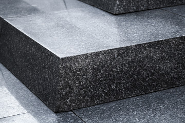 Black shiny granite stairs, abstract photo
