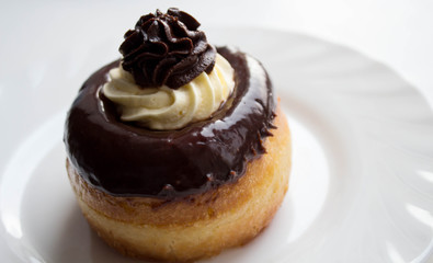 a delicious rum cake with chocolate and butter cream on a plate