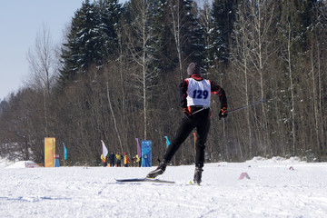 A couple cross country skis in fresh snow in .