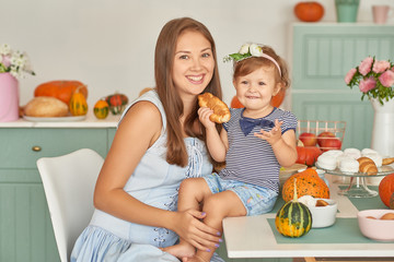 Family Thanksgiving Day. Family in kitchen.Tanksgiving celebration table with traditional festive food. Tanksgiving celebration dinner setting meal concept. Halloween Pumpkins.Autumn feast.Mothers Day