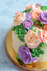 Cake with buttercream roses close-up.