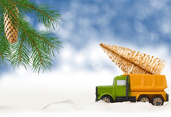 stylized image of a toy car and Christmas tree closeup