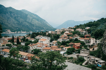 Fototapeta na wymiar Aerial view of Kotor - a city on the Adriatic coast in Montenegro. One of the most beautiful coastal cities of Montenegro. Near a beautiful mountain landscape.