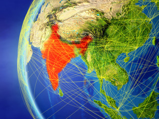 India from space on model of Earth with international network. Concept of digital communication or travel.
