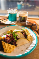 Salad on a wooden table in front of the viewport
