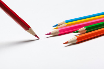 Wooden colorful ordinary pencils isolated on a white background