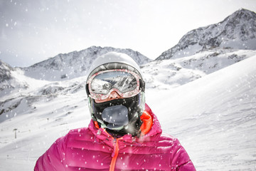 Fototapeta na wymiar Women skier and mountains landscape. Snowflakes decoration 