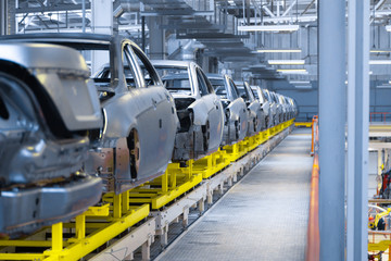 Movement of vehicles along the production line at the plant. Car Assembly shop. Car Assembly by...