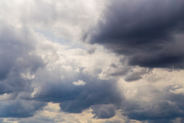 Clouds after rain before sunset as a background