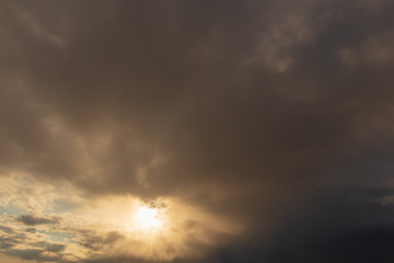 Clouds after rain before sunset as a background