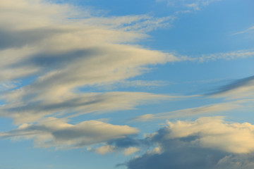 Clouds after rain before sunset as a background