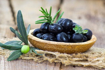 black olives and herbs in a bowl