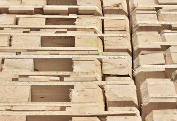 Stacked wooden pallets as background