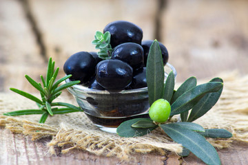 black olives and herbs in a bowl