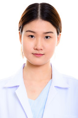 Face of young beautiful Asian woman doctor