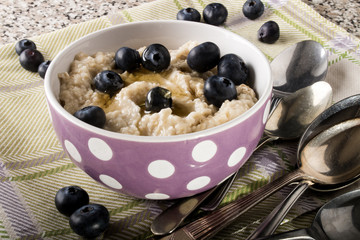 porridge made with honey and blueberries