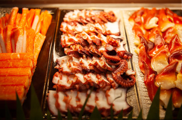 Assortment of tasty and delicious Sashimi or sliced raw fish and seafood. Most popular Japanese food. Low in saturated fat, rich in omega-3 fatty acid and vitamin. Healthy eating and eat well concept.