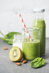 Healthy organic smoothie in glasses with ingredients