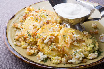 Potato pancakes draniki served with sour cream