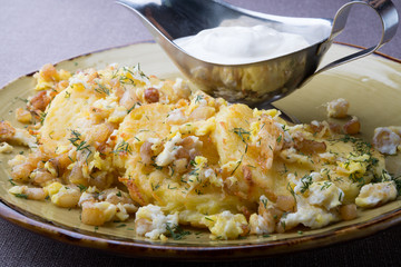 Potato pancakes draniki served with sour cream