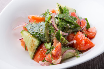 Fresh raw tomato and cucumber mixed salad