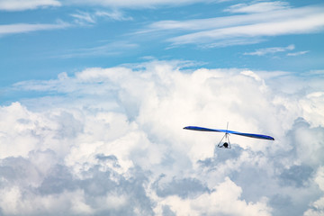 Light aircraft, deltaplane, against the sky with white clouds. deltaplane