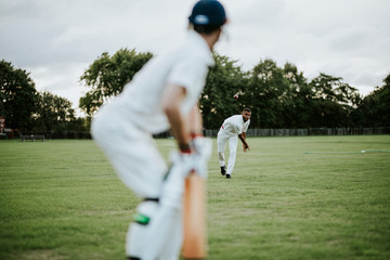 Cricket bowler throwing the ball