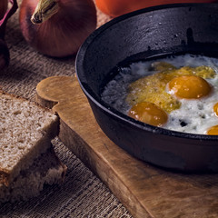 quail fried eggs in a pan