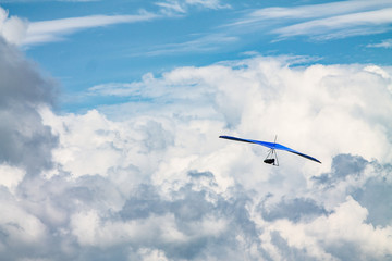 Light aircraft, deltaplane, against the sky with white clouds. deltaplane