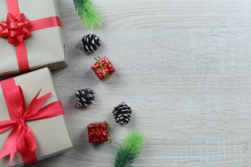 Brown gift box Equipment for Christmas decoration on wooden floor background.