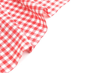 Red checked picnic cloth on white background.