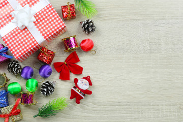 Red gift box of Equipment for Christmas decoration on wooden floor background and have copy space.