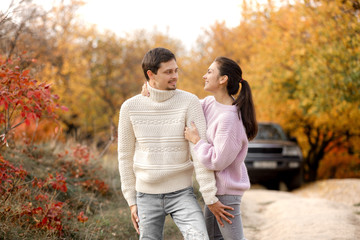 Fototapeta premium Couple in love in the autumn leaves