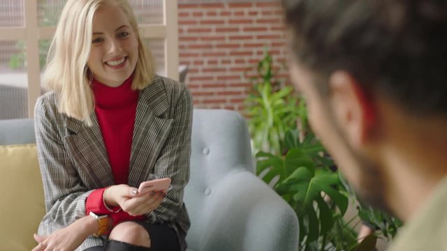 businessman using tablet computer browsing data on screen colleagues meeting client shaking hands enjoying professional business people collaborating planning partnership in startup office