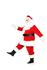 side view of santa claus walking and looking at camera isolated on white