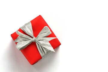Red gift box isolated on white with close-up.