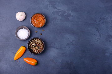Fototapeta na wymiar Sauce with salt and pepper and garlic