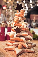 Christmas tree made from Gingerbread cookies with icing frosting glazed and chocolate. Flavored...