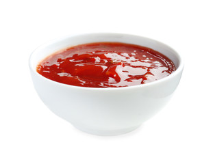 Tasty tomato sauce in bowl on white background