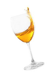Glass of tasty wine with splashes on white background